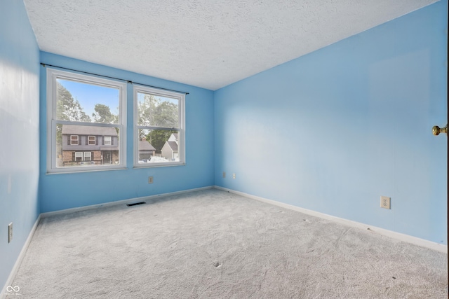 1826 Shorter Dr, Indianapolis, IN 46214 - carpeted empty room with baseboards and a textured ceiling