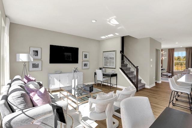 6702 Halsey St, Zionsville, IN 46077 - living area featuring a chandelier, stairs, wood finished floors, recessed lighting, and baseboards