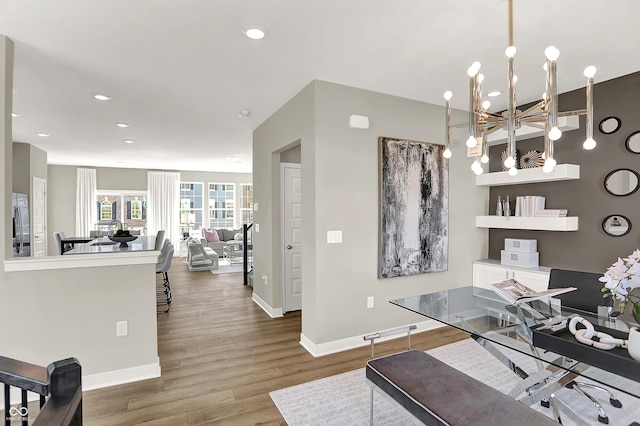 6702 Halsey St, Zionsville, IN 46077 - office space with baseboards, wood finished floors, recessed lighting, and a chandelier