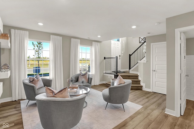 6702 Halsey St, Zionsville, IN 46077 - living room with light wood-style floors, baseboards, stairs, and recessed lighting