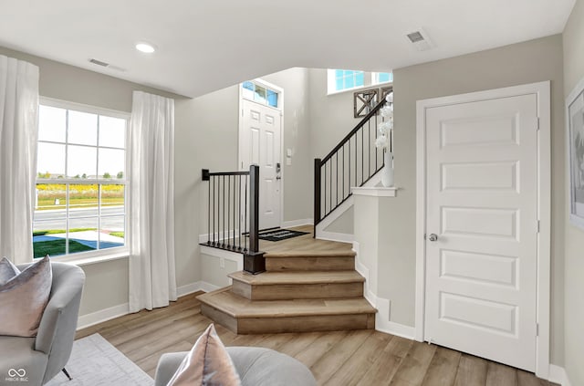 6702 Halsey St, Zionsville, IN 46077 - stairs with wood finished floors, baseboards, healthy amount of natural light, and recessed lighting