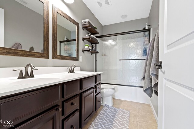 13485 Mancroft Dr, Fishers, IN 46037 - bathroom featuring toilet, enclosed tub / shower combo, double vanity, and tile patterned flooring