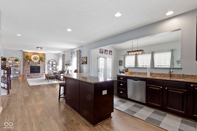 13485 Mancroft Dr, Fishers, IN 46037 - kitchen with dishwasher, a sink, light wood-style flooring, healthy amount of natural light, and recessed lighting