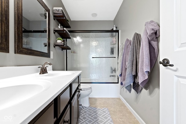 13485 Mancroft Dr, Fishers, IN 46037 - full bathroom featuring toilet, shower / bath combination with glass door, double vanity, and baseboards