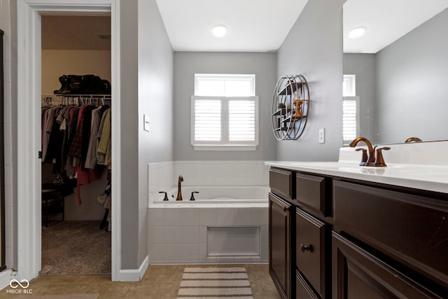 13485 Mancroft Dr, Fishers, IN 46037 - full bathroom with a bath, vanity, a spacious closet, tile patterned floors, and a shower