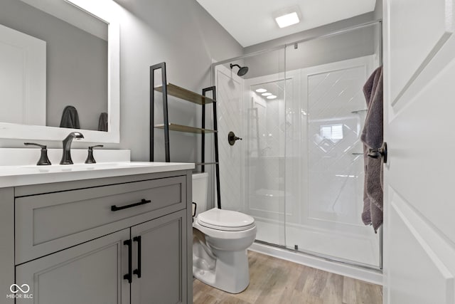 13485 Mancroft Dr, Fishers, IN 46037 - full bathroom with vanity, toilet, a shower stall, and wood finished floors