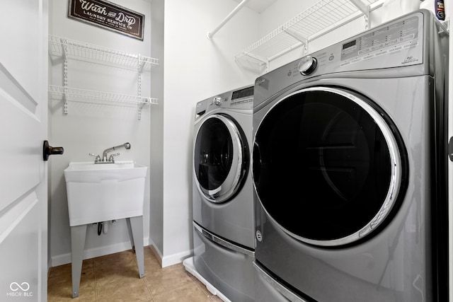13485 Mancroft Dr, Fishers, IN 46037 - laundry area featuring independent washer and dryer, baseboards, and light tile patterned floors