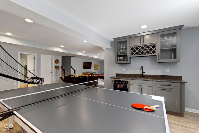 13485 Mancroft Dr, Fishers, IN 46037 - playroom featuring wine cooler, wet bar, light wood-type flooring, recessed lighting, and baseboards