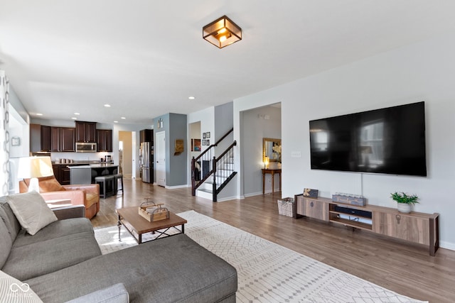 13485 Mancroft Dr, Fishers, IN 46037 - living area with stairway, light wood-type flooring, baseboards, and recessed lighting