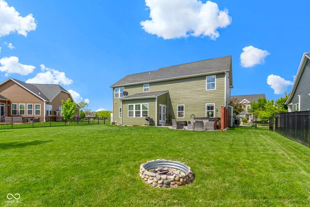 13485 Mancroft Dr, Fishers, IN 46037 - rear view of property with a patio area and a fire pit