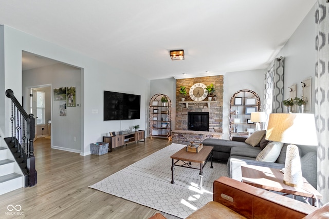 13485 Mancroft Dr, Fishers, IN 46037 - living area with wood finished floors, stairway, plenty of natural light, and baseboards