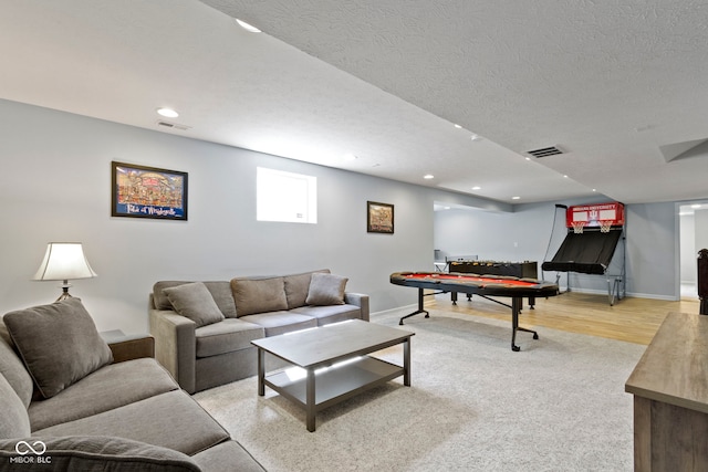 13485 Mancroft Dr, Fishers, IN 46037 - living room with baseboards, recessed lighting, a textured ceiling, and light wood-type flooring