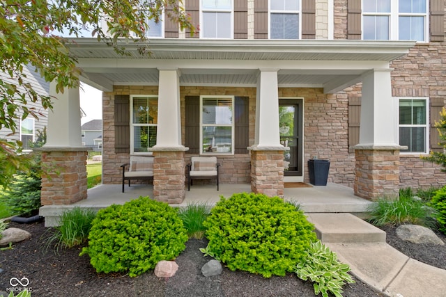 13485 Mancroft Dr, Fishers, IN 46037 - property entrance featuring covered porch and stone siding