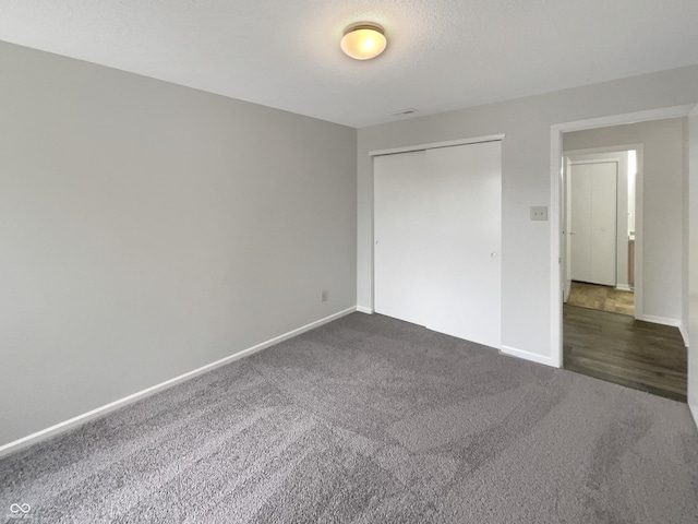 15110 Fawn Hollow Ln, Noblesville, IN 46060 - unfurnished bedroom with dark colored carpet, baseboards, and a closet