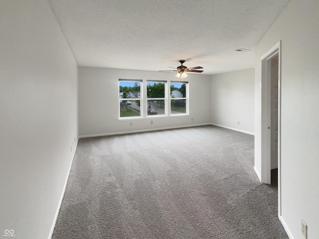 15110 Fawn Hollow Ln, Noblesville, IN 46060 - carpeted spare room with ceiling fan, baseboards, and a textured ceiling