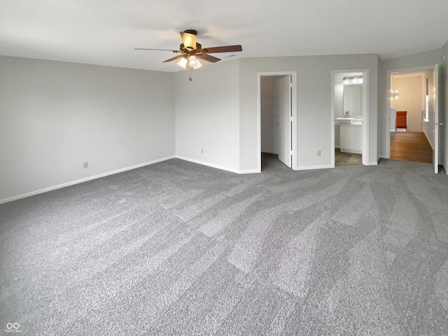 15110 Fawn Hollow Ln, Noblesville, IN 46060 - unfurnished bedroom with baseboards, a walk in closet, carpet, and ceiling fan