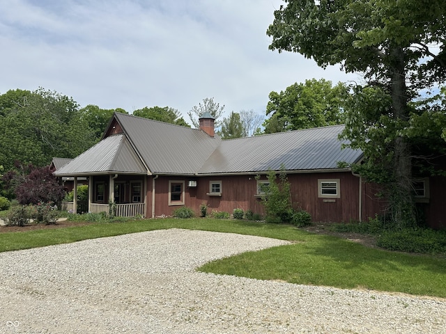 2034 Dubois Rd, Spencer, IN 47460 - ranch-style home featuring a chimney, covered porch, a front yard, and metal roof