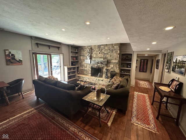 2034 Dubois Rd, Spencer, IN 47460 - living area featuring a textured ceiling, wood-type flooring, built in shelves, a fireplace, and recessed lighting
