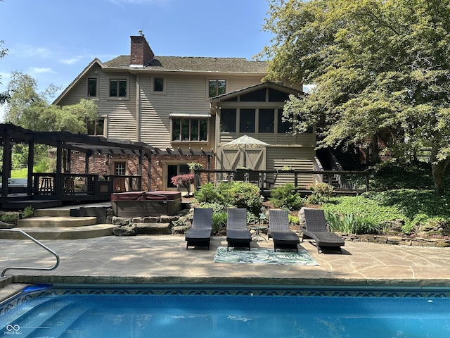 2034 Dubois Rd, Spencer, IN 47460 - swimming pool featuring a hot tub, a pergola, a patio, and a deck