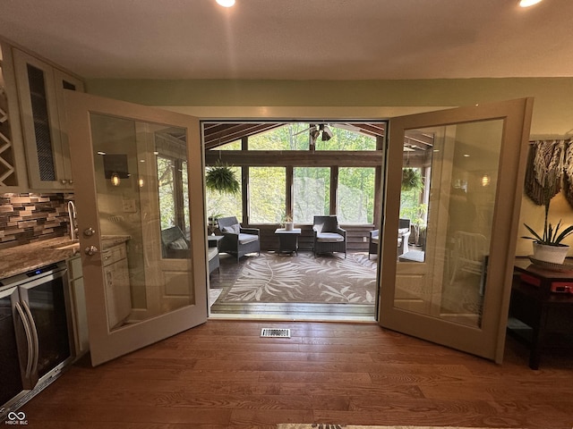 2034 Dubois Rd, Spencer, IN 47460 - doorway featuring wine cooler, wood finished floors, and recessed lighting