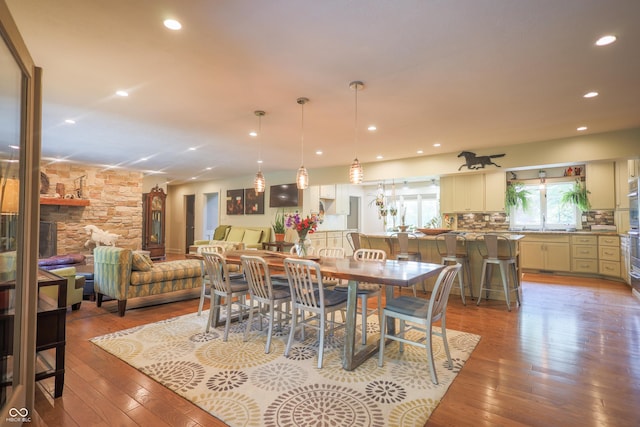 2034 Dubois Rd, Spencer, IN 47460 - dining area featuring light wood-style floors, recessed lighting, and a fireplace