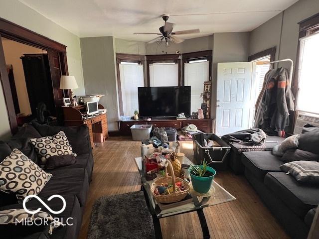 1304 Franklin St, Columbus, IN 47201 - living room with wood finished floors and a ceiling fan