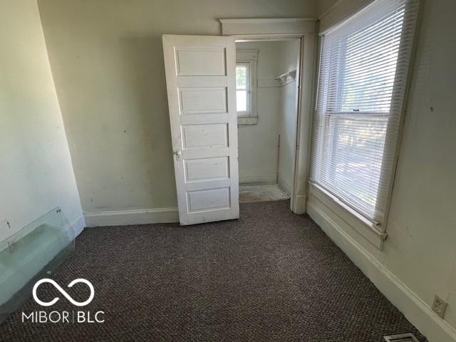 1304 Franklin St, Columbus, IN 47201 - unfurnished bedroom featuring carpet floors and baseboards