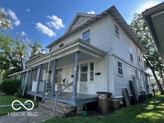 1304 Franklin St, Columbus, IN 47201 - view of side of property with covered porch and a yard