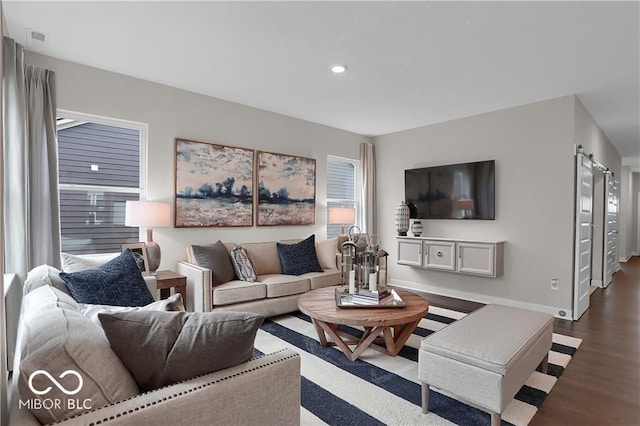 19390 Mcbee Ave, Westfield, IN 46074 - living room featuring dark wood-style floors, a barn door, recessed lighting, and baseboards