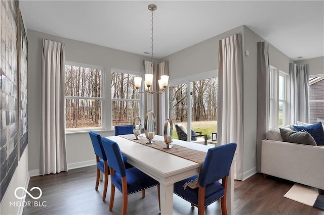 19390 Mcbee Ave, Westfield, IN 46074 - dining space featuring a chandelier, plenty of natural light, dark wood-type flooring, and baseboards