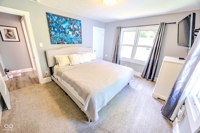 517 Bernard Ave, Indianapolis, IN 46208 - bedroom with baseboards and light carpet