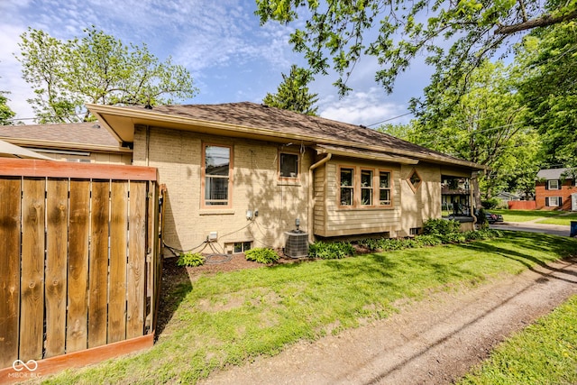 517 Bernard Ave, Indianapolis, IN 46208 - rear view of house featuring cooling unit and brick siding