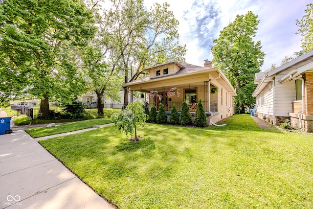 517 Bernard Ave, Indianapolis, IN 46208 - view of front of property with a chimney, a porch, and brick siding