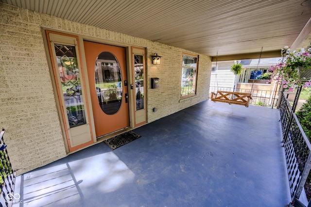 517 Bernard Ave, Indianapolis, IN 46208 - property entrance featuring brick siding and covered porch