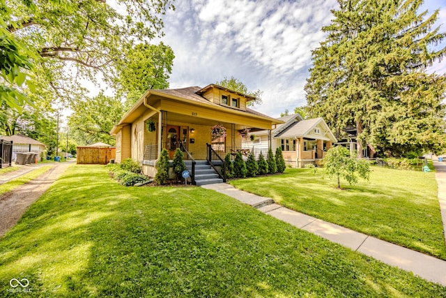 517 Bernard Ave, Indianapolis, IN 46208 - bungalow-style house with a porch and a front yard