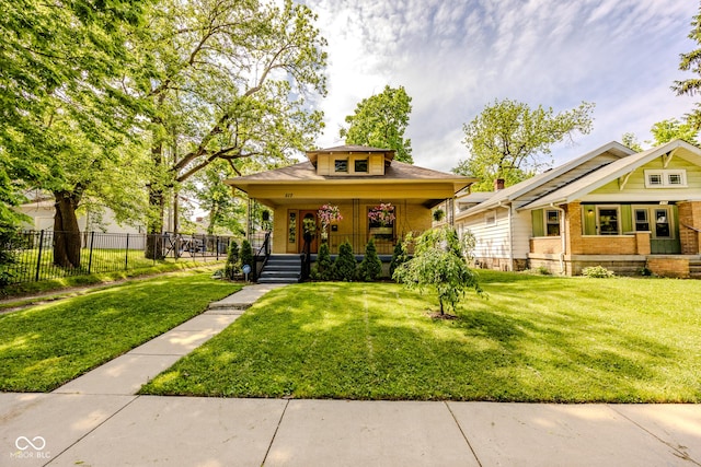 517 Bernard Ave, Indianapolis, IN 46208 - bungalow-style home with covered porch and brick siding