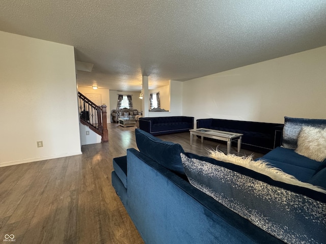 5502 Floating Leaf Dr, Indianapolis, IN 46237 - living room with wood finished floors, stairway, a textured ceiling, and baseboards