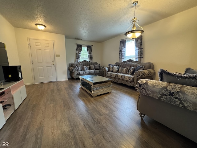 5502 Floating Leaf Dr, Indianapolis, IN 46237 - living area with dark wood-type flooring and a textured ceiling