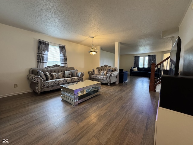 5502 Floating Leaf Dr, Indianapolis, IN 46237 - living room with a textured ceiling, plenty of natural light, and dark wood-type flooring