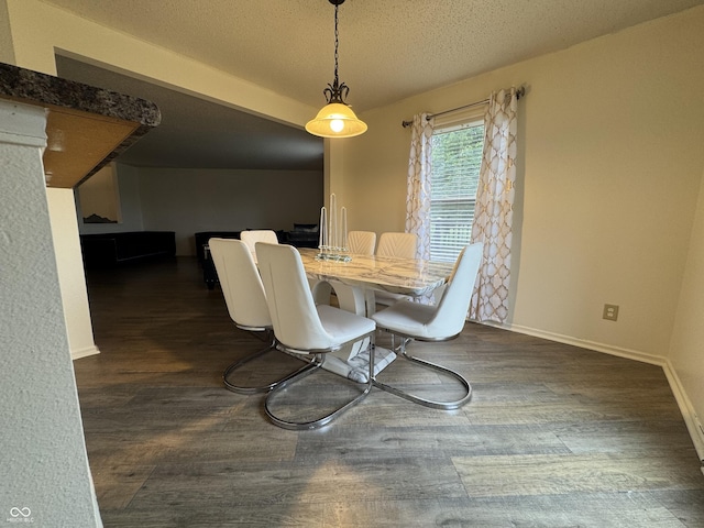 5502 Floating Leaf Dr, Indianapolis, IN 46237 - dining space featuring dark wood-style floors, baseboards, and a textured ceiling