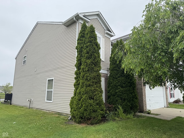 5502 Floating Leaf Dr, Indianapolis, IN 46237 - view of home's exterior with a lawn and a garage