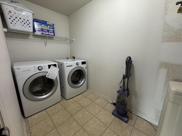 5502 Floating Leaf Dr, Indianapolis, IN 46237 - washroom featuring washer and dryer, a textured ceiling, and baseboards