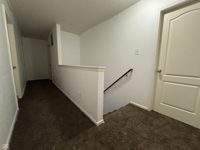 5502 Floating Leaf Dr, Indianapolis, IN 46237 - hallway with an upstairs landing, carpet floors, a textured ceiling, and baseboards