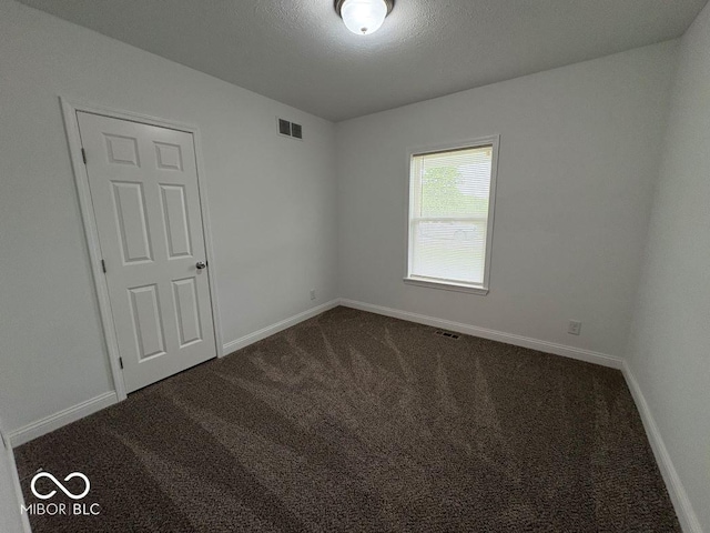 844 Ben Franklin St, Cloverdale, IN 46120 - spare room with dark carpet and baseboards