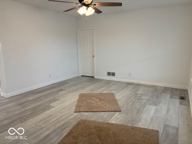 844 Ben Franklin St, Cloverdale, IN 46120 - empty room featuring a ceiling fan, light wood-type flooring, and baseboards