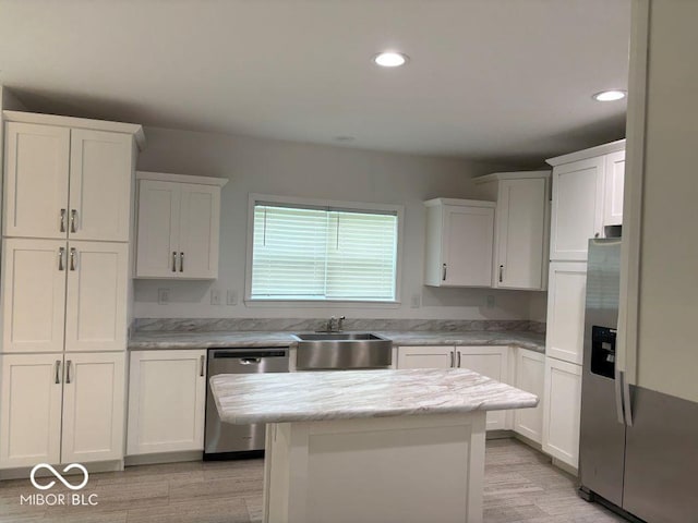 844 Ben Franklin St, Cloverdale, IN 46120 - kitchen with stainless steel appliances, a sink, white cabinetry, and recessed lighting