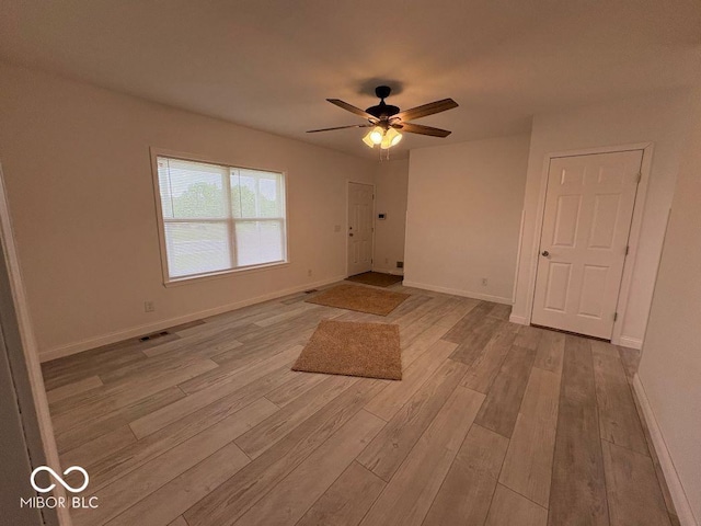 844 Ben Franklin St, Cloverdale, IN 46120 - empty room featuring light wood-style floors, ceiling fan, and baseboards