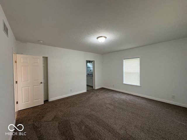 844 Ben Franklin St, Cloverdale, IN 46120 - unfurnished bedroom featuring dark carpet and baseboards