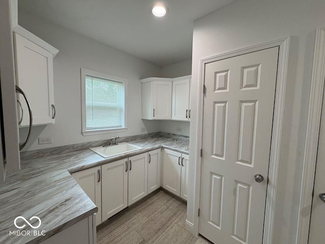 844 Ben Franklin St, Cloverdale, IN 46120 - kitchen with a sink and white cabinetry