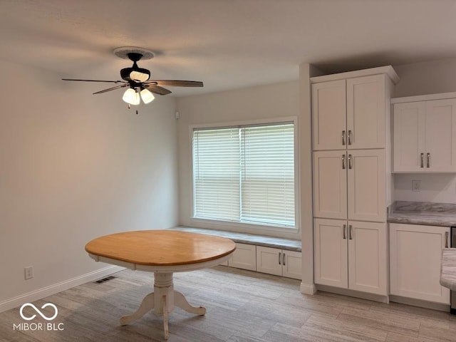 844 Ben Franklin St, Cloverdale, IN 46120 - dining space with ceiling fan, light wood-style flooring, and baseboards